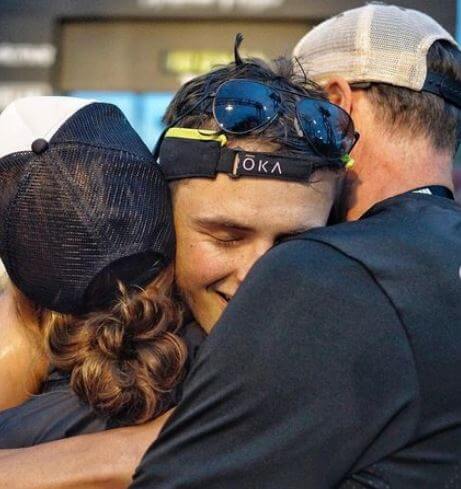 Dylan Efron hugging his parents.
